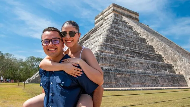 Couple in front of the Chichen Itza pyramid